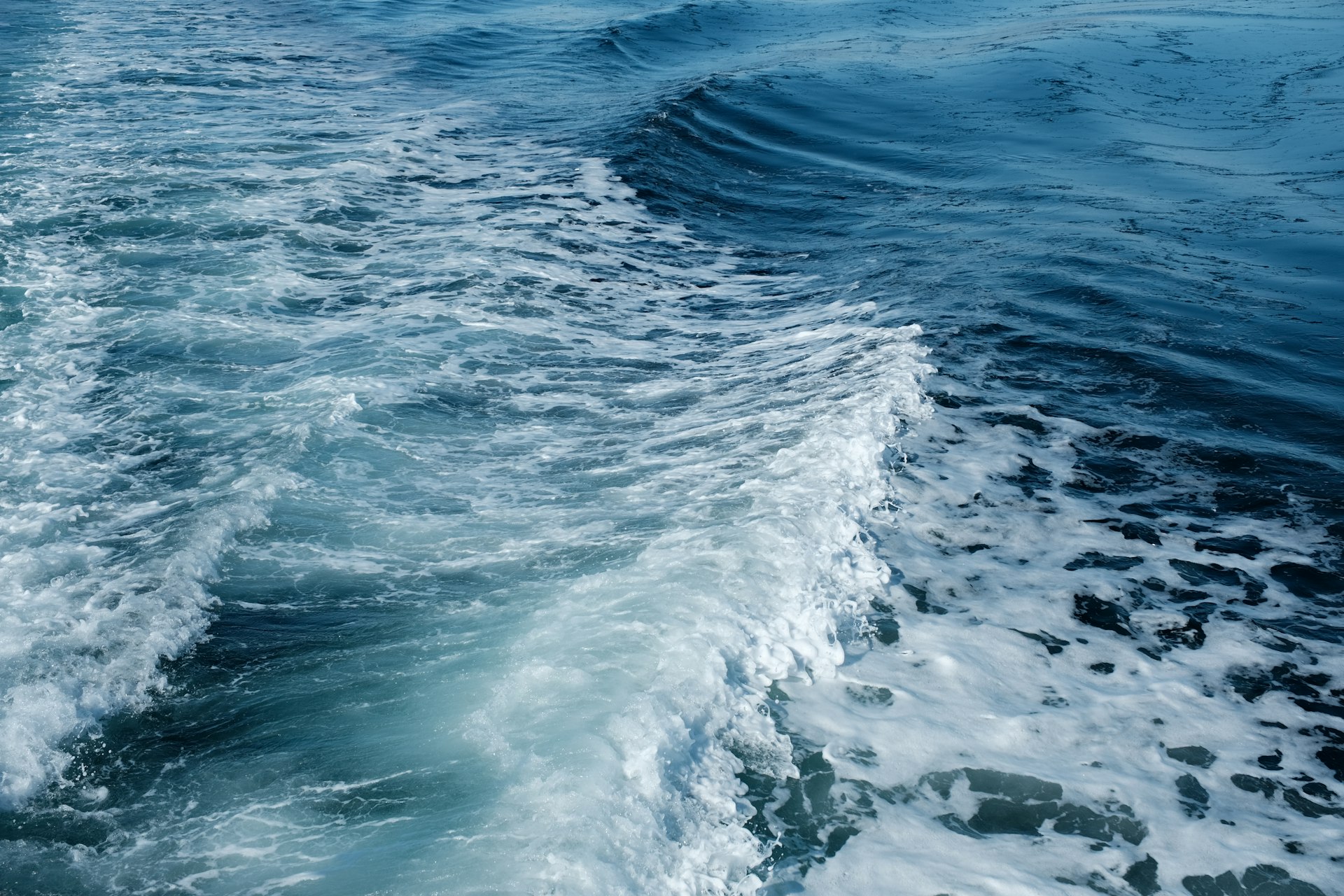 The wake of a boat in the ocean